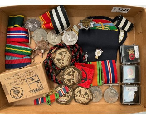 A collection of medals and insignia including medal group of four consisting of 1939-45 star, Pacific Star and George VI Terr