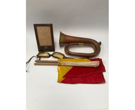 A 1949 dated Henry Potter copper and brass bugle, a pair of signalling flags, a pair of goggles and a Worcestershire Regiment