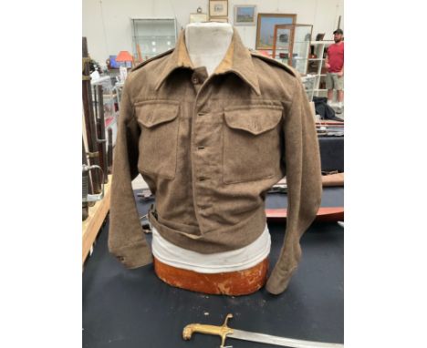 A WWII British 1940 pattern battledress blouse, size 12, serviceman was an RSS in the Royal Signals, slight mothing 