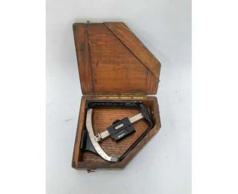 A WWII 1943 dated Mk. VI artillery clinometer in its original wooden case 