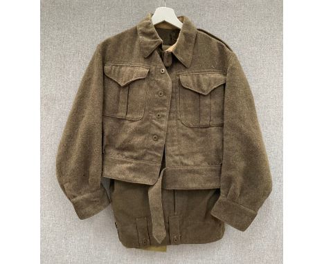 A WWII 1940 pattern Canadian battledress blouse dated 1944, together with a later pair of battledress trousers 