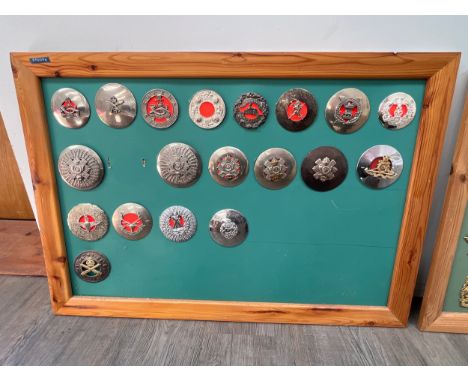 A framed display of Plaid Brooches including 9th and 10th Gurkhas, Highland Light Infantry and 4th Scottish Tanks 