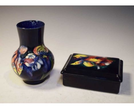 Moorcroft pottery 'Orchid' pattern bulbous vase, 12.5cm high, and lidded rectangular box 12cm wide, (2)