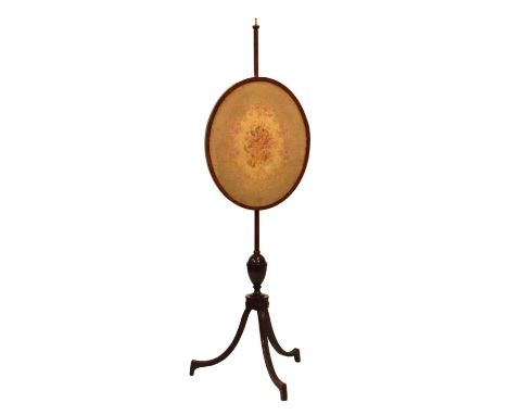 19th Century mahogany polescreen, with oval floral tapestry panel, the turned stem with cup and cover ornament splayed tripod