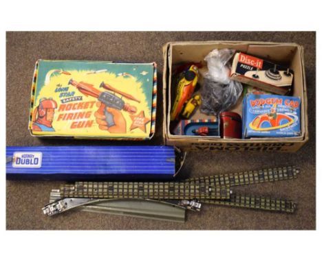 Assorted vintage toys and games, including Lone Star gun, German helicopter toy, dodgem car, sentry money box, money post box