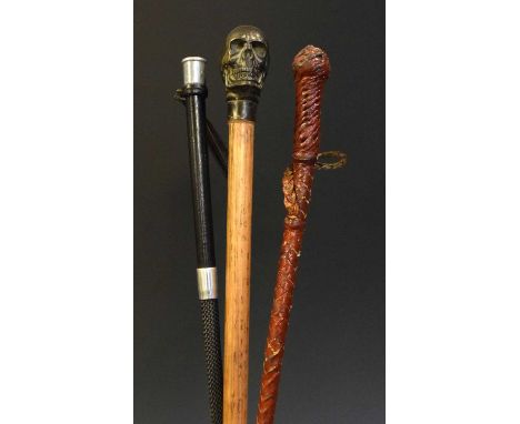 Walking stick having carved skull grip, together with two riding crops