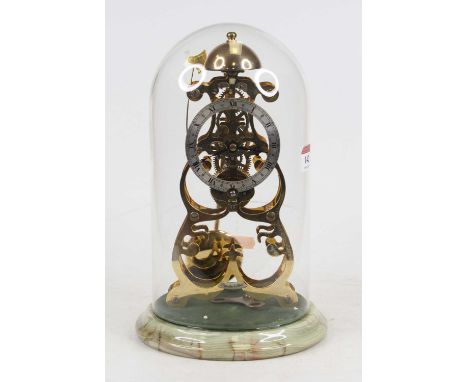 A 20th century brass skeleton clock, the silvered chapter ring showing Roman numerals and bearing label for Thwaites &amp; Re