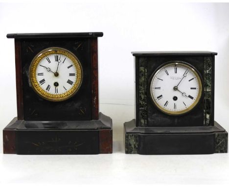 A Victorian black slate and green marble cased mantel clock, of typical form, having an enamelled dial with Roman numerals an