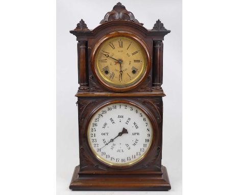 An E. Ingraham &amp; Co. walnut cased twin dial calender shelf clock, of architectural form, the upper papered dial with Roma