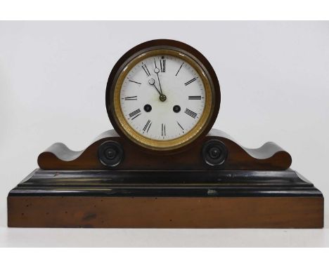 A Victorian walnut and ebonised drum head mantel clock, having an enamelled dial with Roman numerals and twin winding holes, 