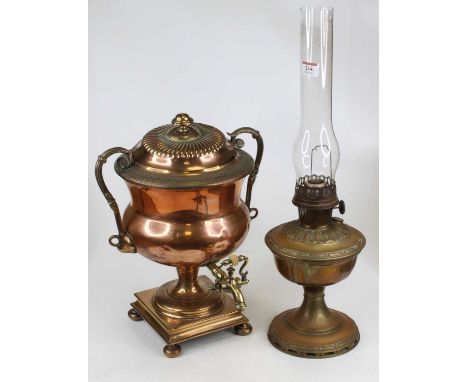 A 19th century copper samovar, the gadrooned lid surmounted by a finial, having twin scroll handles and typical protruding ta