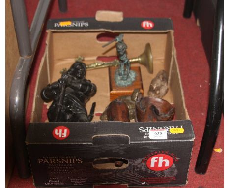 A painted spelter model of a soldier in standing pose with axe in hand and sword at his waist, a brass ecclesiastical cross, 