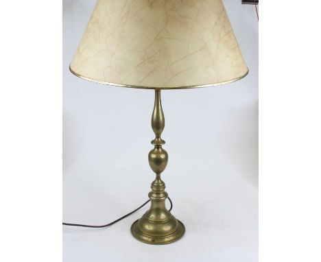 A brass three light table lamp having a knopped column on circular base, height including shade 75cm