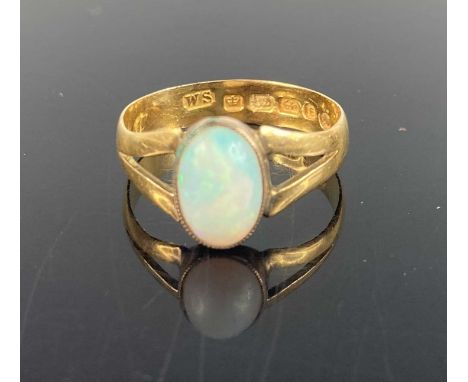 A 22ct gold and cabochon opal set ring (appears to be converted from wedding band) 2.9g, size O