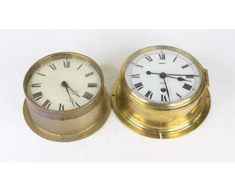 A Sestrel brass cased ship's bulkhead clock having a circular enamel dial with Roman numerals and Arabic outer scale, with si