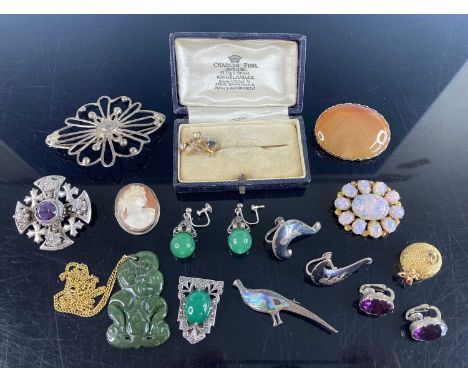 A small collection of silver and other costume jewellery, to include; sundry brooches, earrings, Jade tiki pendant etc
