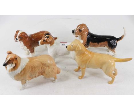 A collection of five Beswick models of dogs, to include a Jack Russell terrier, and a Yellow Labrador