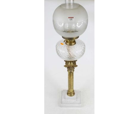 A 20th century oil lamp having clear glass chimney and etched frosted glass shade on brass burner, clear glass reservoir to c