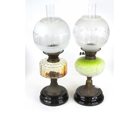 A Victorian oil lamp having a clear glass chimney and etched, frosted and clear glass shade to burner, clear glass reservoir 