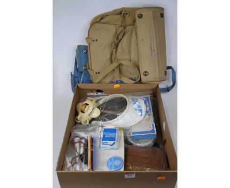 A collection of Pan Am Airlines memorabilia to include bag, suit carrier, clock, pen set, perfume set, desk top model plane s