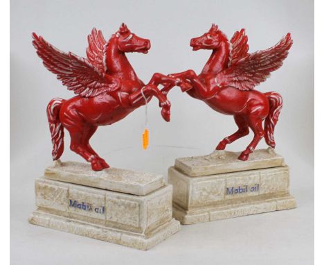 A pair of painted cast iron Mobil Oil advertising figures, each in the form of a winged horse on a plinth base, height 34cmMo
