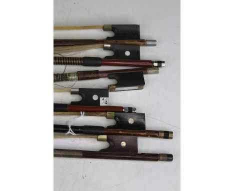 A collection of six vintage full size violin bows