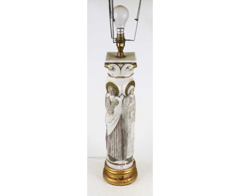 A porcelain column shaped table lamp in the form of four saints, surmounted by corinthian capital on gilt painted socle, heig