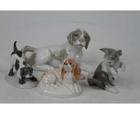 A collection of four porcelain models of cats and dogs, to include Nao, Lladro and RosenthalKitten’s foot is re-attached, res