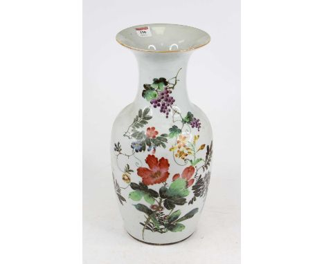 A Chinese porcelain vase of slight baluster shape having a recessed neck, and flared rim, the body enamel decorated with flow