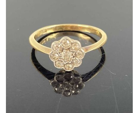 An Art Deco period 18ct gold diamond set flower head cluster ring, setting dia. 8.5mm, 1.9g, size KIntact, and wearable. Ston