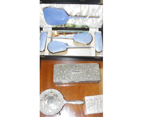 An Art Deco dressing table set, with faux guilloche enamel backs, comprising hand mirror, two hairbrushes and two clothes bru