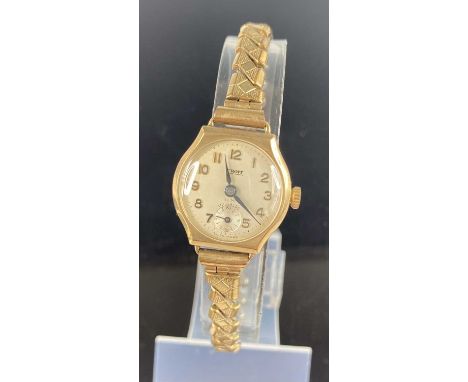 A lady's vintage Croft 9ct gold cased manual wind wristwatch, case dia. 21mm on replacement gilt metal expanding link bracele