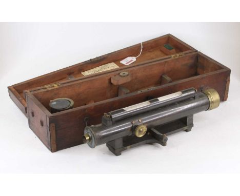 A 19th century lacquered brass surveyor's theodolite of cylindrical form with upper spirit level, and brass lens, engraved C 