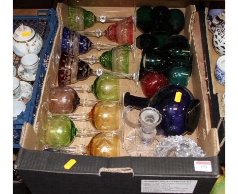 A collection of glass ware to include a set of five coloured glass goblets, wine hocks, and table candlesticksAll pieces show