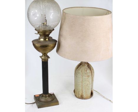 A 20th century Studio pottery table lamp, of naturalistic form, height including shade 57cm, together with a Victorian brass 