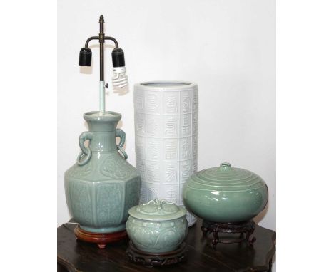 A Chinese celadon glazed table lamp of twin handled shouldered octagonal form, mounted to turned hardwood plinth, height excl