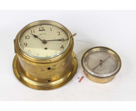 A Smiths lacquered brass cased ship's bulkhead clock, having a signed enamel dial with Arabic numerals and outer track with 3