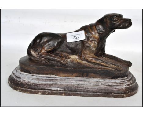 A 20th century cast bronze sculpture of a Boxer dog raised on a naturalistic plinth in the manner of Mene. Measures 28cm wide