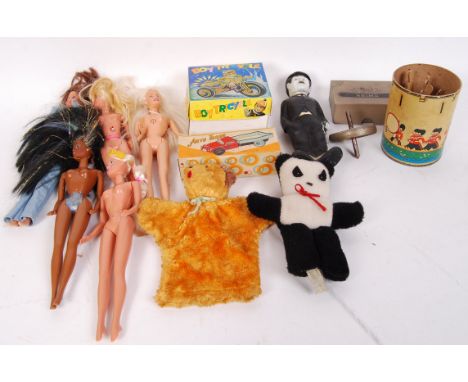 A collection of assorted vintage toys to include; tin Boy Tricycle, hand puppet, panda teddy bear, Charlie Chaplin rubber dol