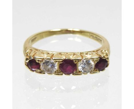 An 18 carat gold ruby and diamond ring, set with five alternating stones, 2.9g, size M, boxedOverall condition is complete an