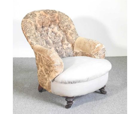 A Victorian button back upholstered armchair