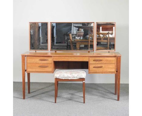 A mid 20th century teak dressing table, by Alfred Cox, with a stool (2)153w x 46d x 120h cm Overall condition looks to be com