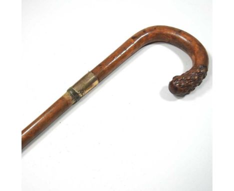 An early 20th century carved wooden walking stick, with an 18 carat gold collar, 84cm long