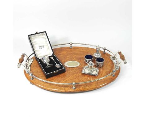 An early 20th century light oak serving tray, with silver plated mounts, 57cm wide, together with a cased silver egg and spoo