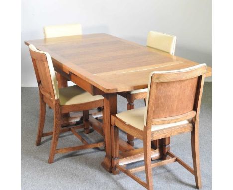 A 1930's light oak draw leaf dining table, together with a set of four matching dining chairs (5)