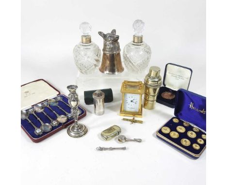A pair of early 20th century silver mounted cut glass scent bottles, 14cm high, together with a gilt brass cased miniature ca