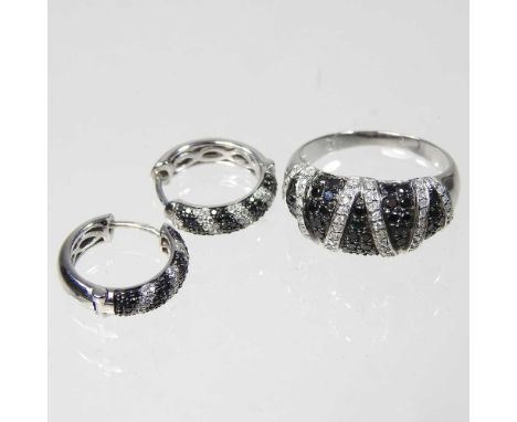 A 9 carat white gold, black and white diamond ring, of zig-zag design, 2.3g, size R/S, together with a pair of matching 9 car