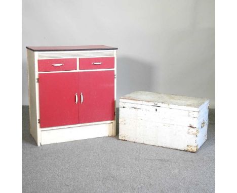 A 1950's painted kitchen cabinet, together with a painted hardwood trunk (2)