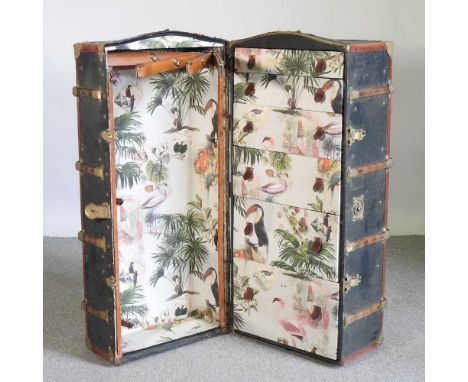 An early 20th century travel trunk, the fitted interior decorated with flamingos and toucans53w x 48d x 114h cmOverall condit