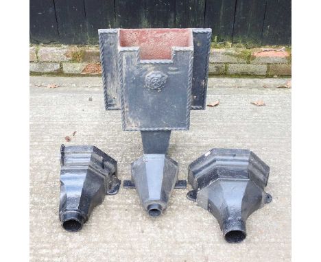 A black painted iron hopper and two others (3)